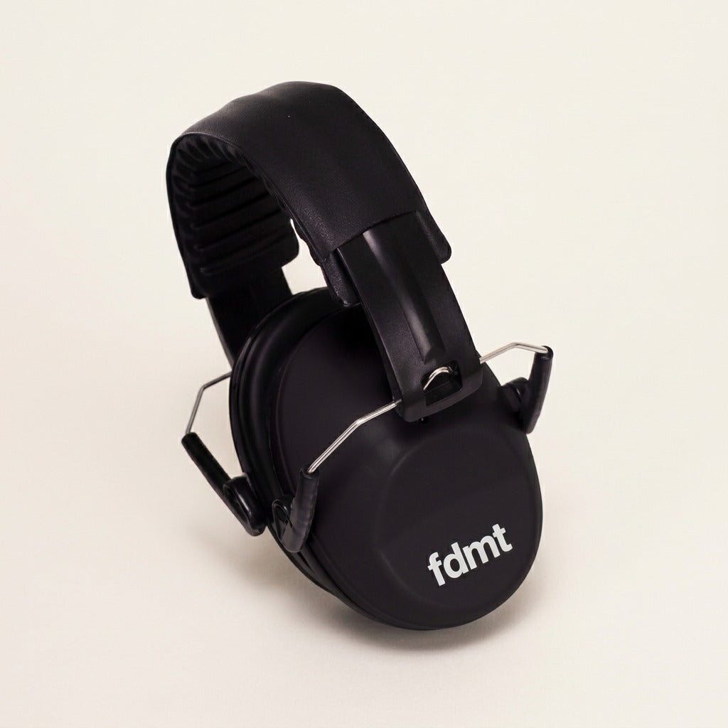 fdmt matte black noise-reducing earmuffs with cushioned ear cups and a padded adjustable headband.